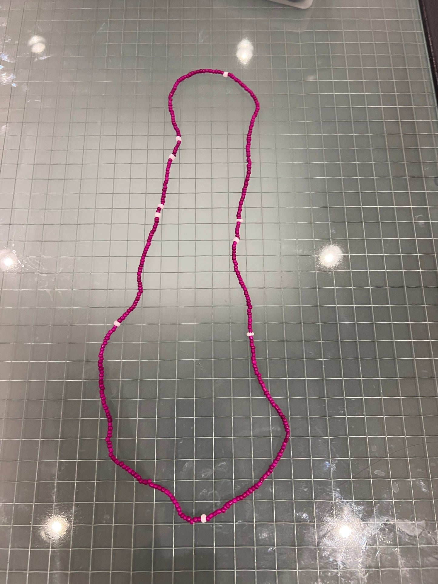 Dark pinkish waist bead